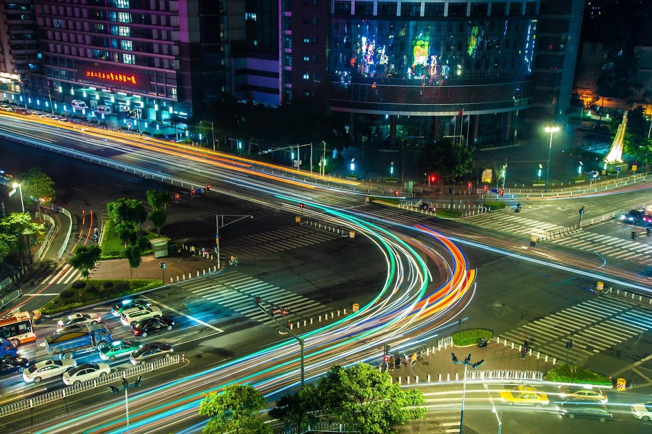 A long exposure photo of an urban street intersection in Guangzhou.